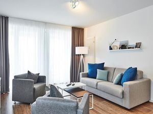 Wohnbereich mit Couch und Sesseln