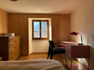 Master bedroom with USM desk and Jean Prouve chair