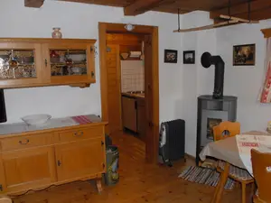 Ferienhäuschen Rosi - Wohnbereich mit gemütlichem Ofen