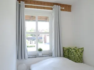 Eines der Schlafzimmer in Keplers Ferienwohnung