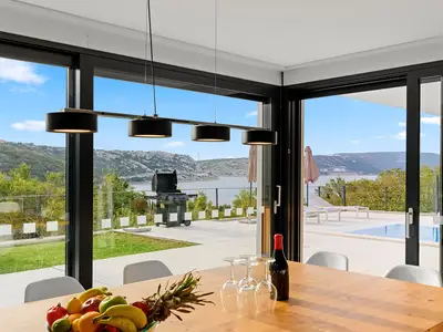 Dining-area-with-a-view-of-Villa-Adria-Blue