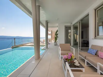 sun deck area (29sqm) with eight deck chairs, a lounge corner, and an outdoor shower