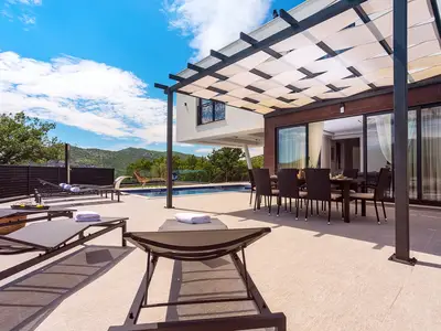 The outdoor offers a private and heated Swimming pool 8m x 4m, 8 deck chairs, outdoor shower, outdoor dining area with the traditional barbecue
