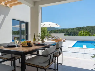 a covered dining area for 8 people
