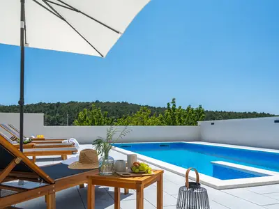 a private, heated 32 sqm (8m x 4m) swimming pool, 6 deck chairs and outdoor shower
