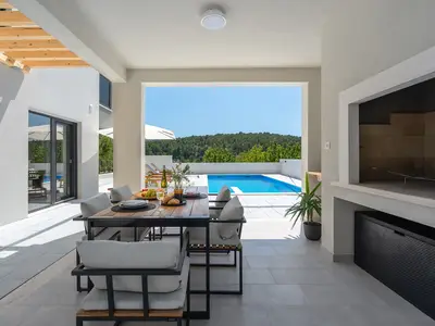 a covered dining area for 8 people
