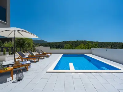 a private, heated 32 sqm (8m x 4m) swimming pool, 6 deck chairs and outdoor shower
