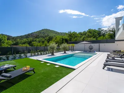 A 40 square meter heated swimming pool and a sun deck with six cozy deck chairs