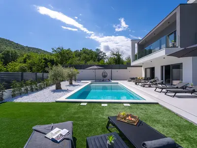 A 40 square meter heated swimming pool and a sun deck with six cozy deck chairs