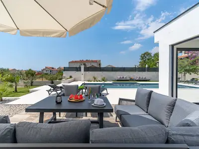  The outdoor area offers a private, heated swimming pool with a no-Chlorine system, with hydro-massage