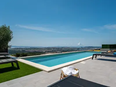 a private swimming pool 11m x 4m with hydro-massage, sun deck area with 8 deck chairs 
