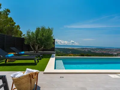 a private swimming pool 11m x 4m with hydro-massage, sun deck area with 8 deck chairs 