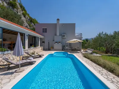 Sun deck area with 4 deck chairs and private pool
