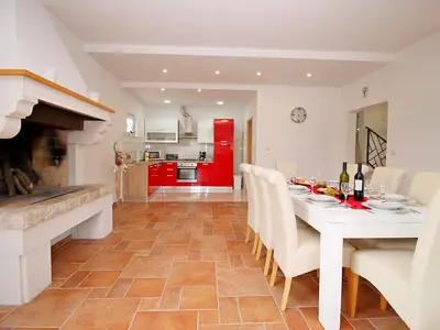Dinning and living area with fully equipped kitchen and access to the pool