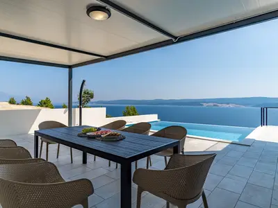 The outdoor area offers covered outdoor dining area with traditional barbecue