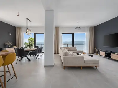 A fully air-conditioned 4-bedroom villa with free WiFi, spacious living area, fully equipped kitchen, a charming outdoor dining area and lounge corner,
