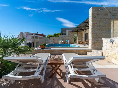 Private heated pool with 8 lounge chairs