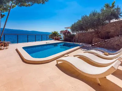 Voll klimatisiert, kostenloses WiFi, 2 Schlafzimmer mit Bad, am Strand