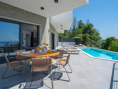 outdoor dining area next to the pool
