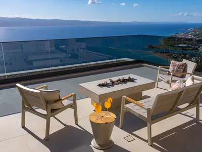West terrace is a half-covered relaxing zone with a lounge corner and outdoor furniture for enjoying spectacular sunsets with a glass of local vine.