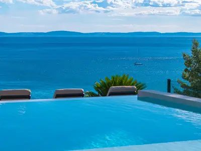 Outdoors offers a private and heated 38sqm infinity pool with a counter-current swimming program