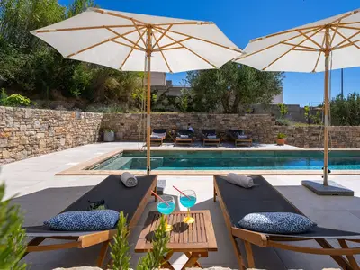 There is a sun deck area with 6 deck chairs, an outdoor shower, a covered outdoor dining area 
