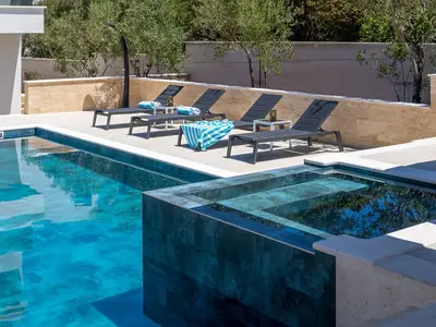 Villa offers several different outdoor sitting areas, a whirlpool attached to a swimming pool, a Finnish sauna