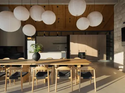 Das stilvolle Interieur verfügt über einen langen Holztisch und eine elegante, hochwertige Sommerküche.