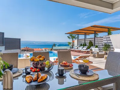 Outdoor covered dining area with amazing sea view